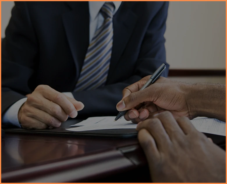 Two people reviewing paperwork