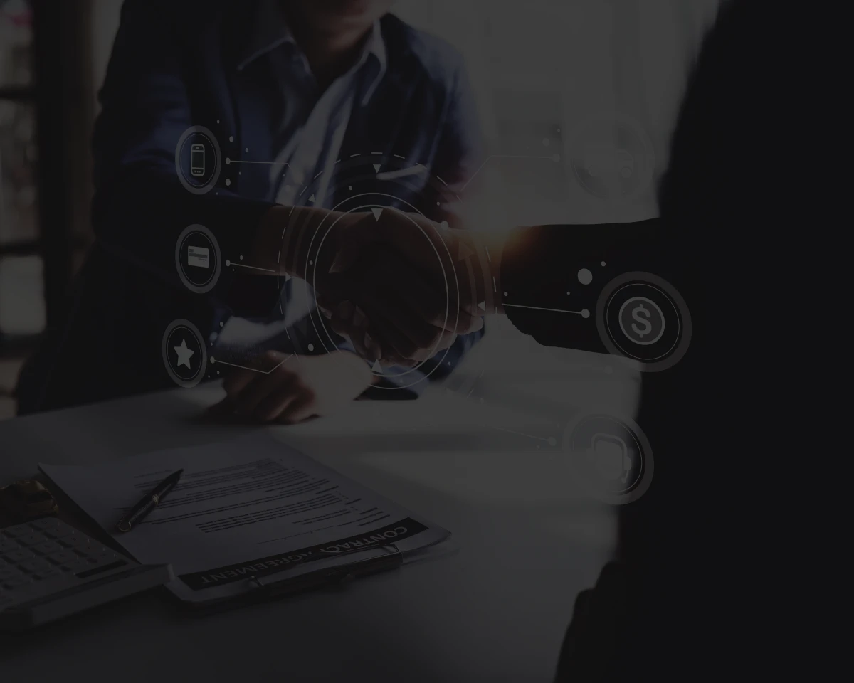 Business handshake with digital icons overlay